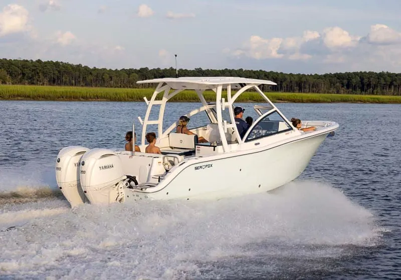 Slide: The Image of 2025 Sea Fox 268 Traveler boat cruising on a scenic waterway. - 1