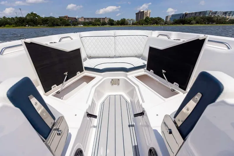 Slide: The Image of 2025 Sea Fox 268 Traveler boat interior with open storage compartments and cushioned seating. - 13
