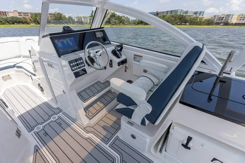 Slide: The Image of 2025 Sea Fox 268 Traveler boat interior with modern dashboard and seating. - 14
