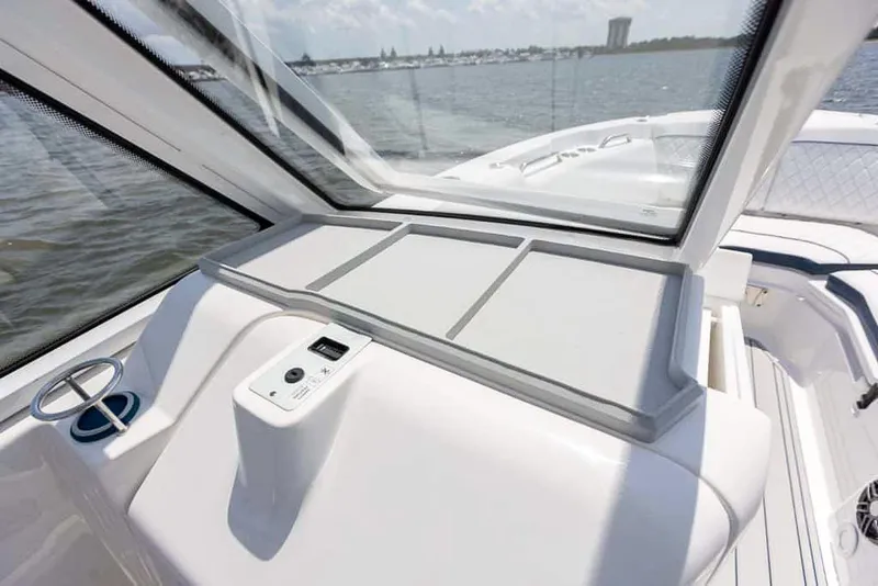 Slide: The Image of 2025 Sea Fox 268 Traveler boat interior with dashboard and water view. - 19