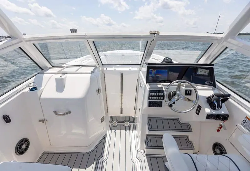 Slide: The Image of 2025 Sea Fox 268 Traveler boat interior with modern dashboard and steering wheel. - 20