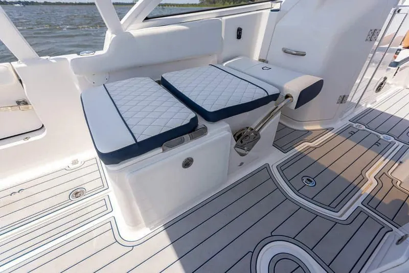 Slide: The Image of 2025 Sea Fox 268 Traveler boat interior with cushioned seating and sleek flooring design. - 26
