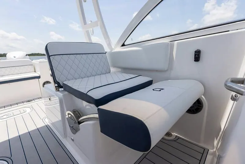 Slide: The Image of 2025 Sea Fox 268 Traveler boat interior with cushioned seating and sleek design. - 28