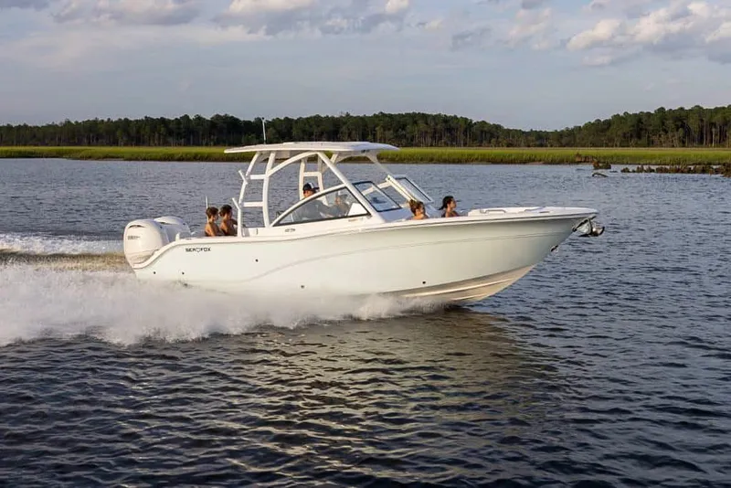 Slide: The Image of 2025 Sea Fox 268 Traveler boat cruising on a scenic lake. - 3