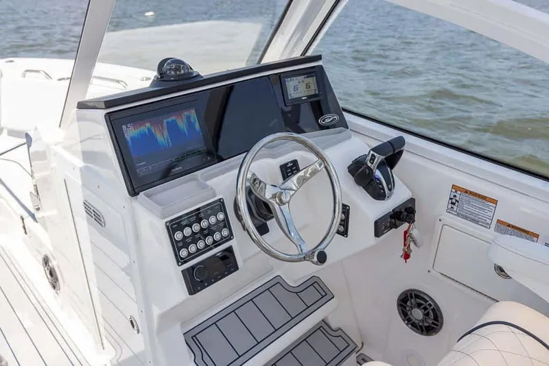 Slide: The Image of 2025 Sea Fox 268 Traveler boat dashboard with modern navigation system and controls. - 31