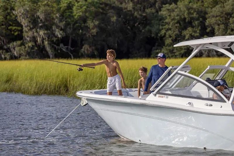 Slide: The Image of Family fishing on a 2025 Sea Fox 268 Traveler boat in a scenic river. - 6