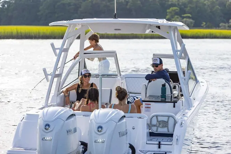 Slide: The Image of 2025 Sea Fox 268 Traveler boat with people enjoying a sunny day on the water. - 9
