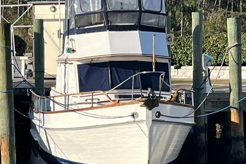 Slide: The Image of 1978 Grand Banks 38 boat docked at a marina. - 0