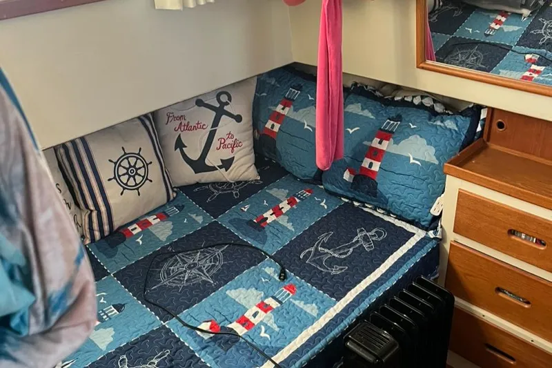 Slide: The Image of Cozy nautical-themed cabin interior on a 1978 Grand Banks 38 boat. - 13
