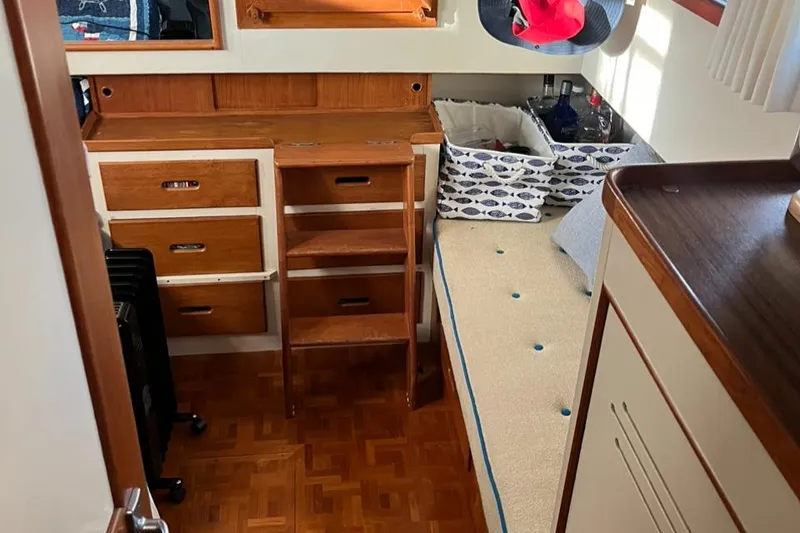 Slide: The Image of 1978 Grand Banks 38 cabin interior with wooden furniture and cozy bed. - 15