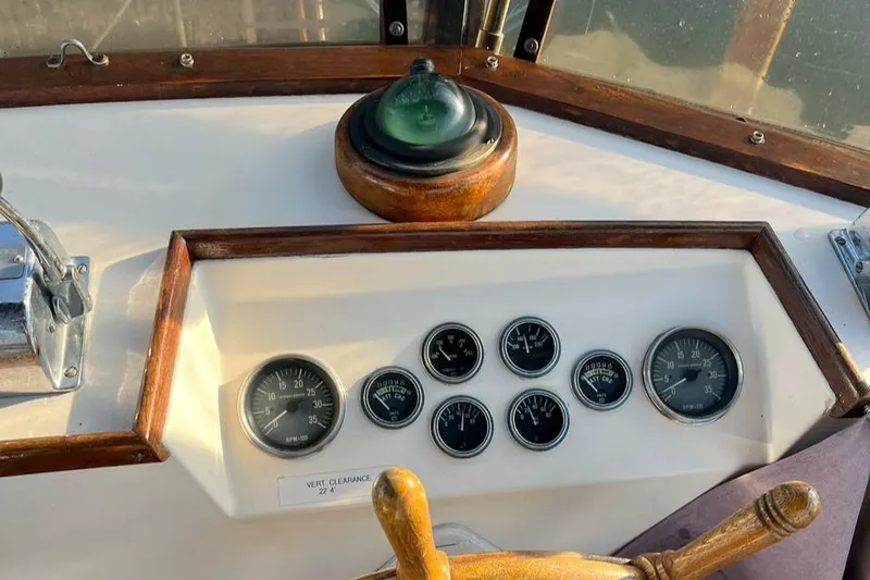 Slide: The Image of 1978 Grand Banks 38 boat dashboard with gauges and compass. - 20