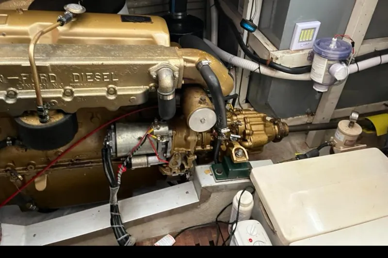 Slide: The Image of Engine room of a 1978 Grand Banks 38 boat, featuring a diesel engine. - 21