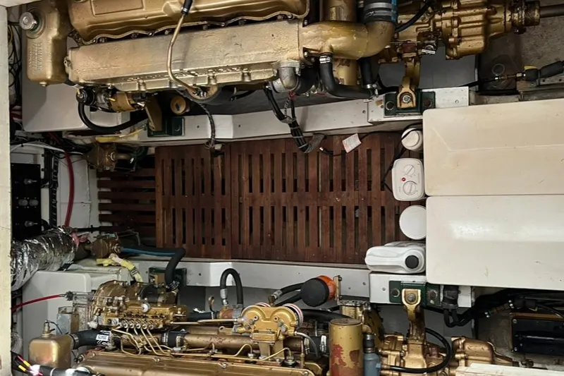 Slide: The Image of Engine room of a 1978 Grand Banks 38 boat, showcasing mechanical components. - 24