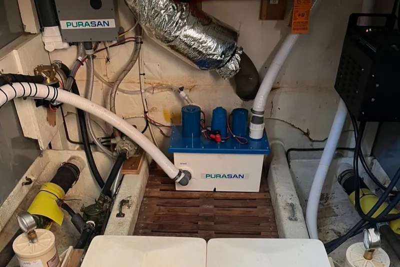 Slide: The Image of Engine room of 1978 Grand Banks 38 with Purasan marine sanitation system. - 25