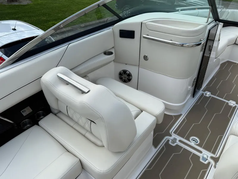 Slide: The Image of 2025 Regal LS6 boat interior with white leather seating and modern design. - 11