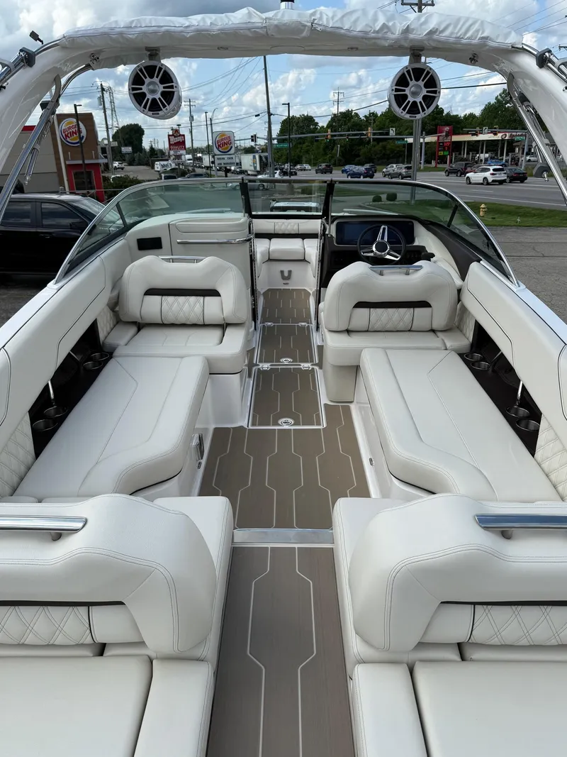 Slide: The Image of Luxurious 2025 Regal LS6 boat interior with white seating and modern design. - 13