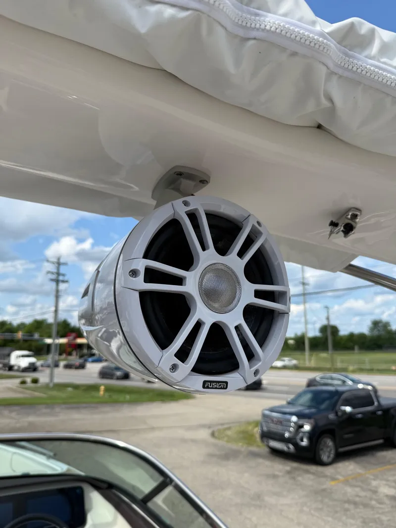 Slide: The Image of Outdoor speaker mounted on a 2025 Regal LS6 boat, with a clear sky background. - 15