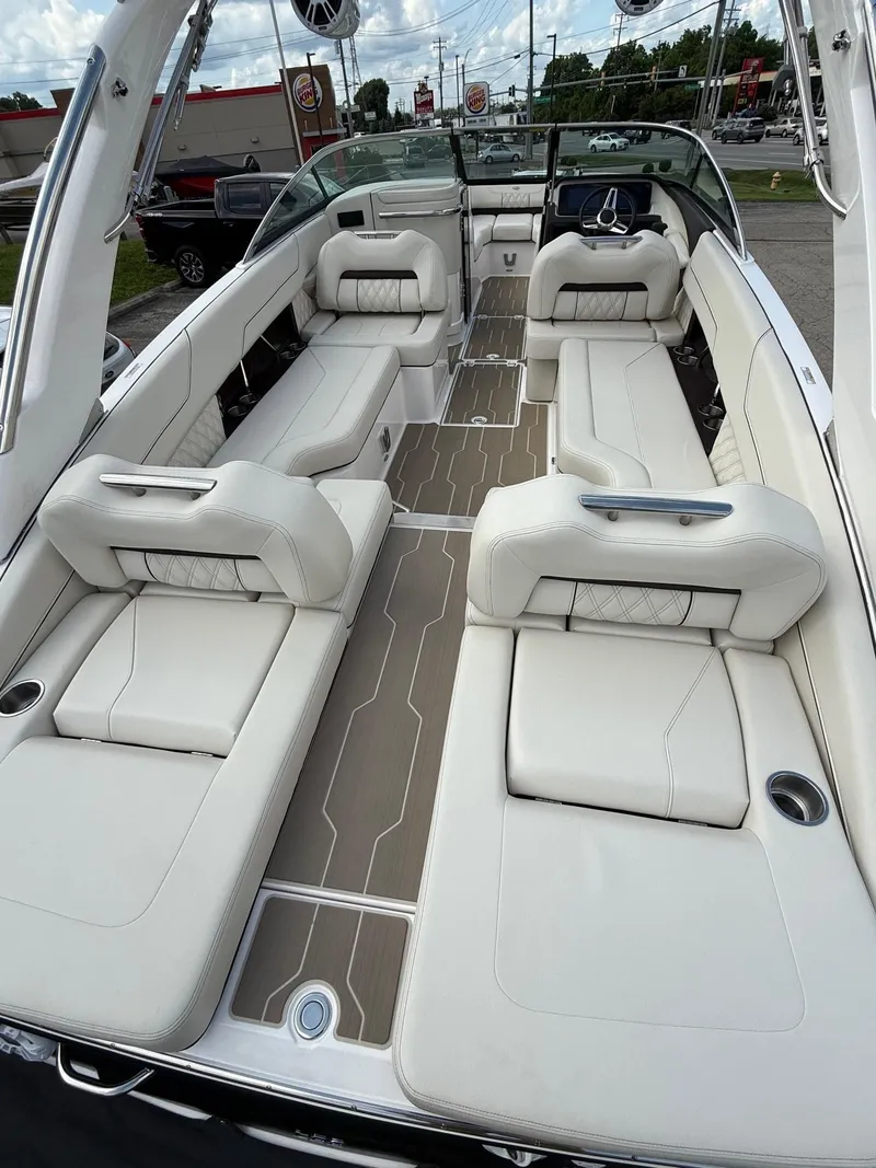 Slide: The Image of 2025 Regal LS6 boat interior with luxurious white seating and modern design. - 3