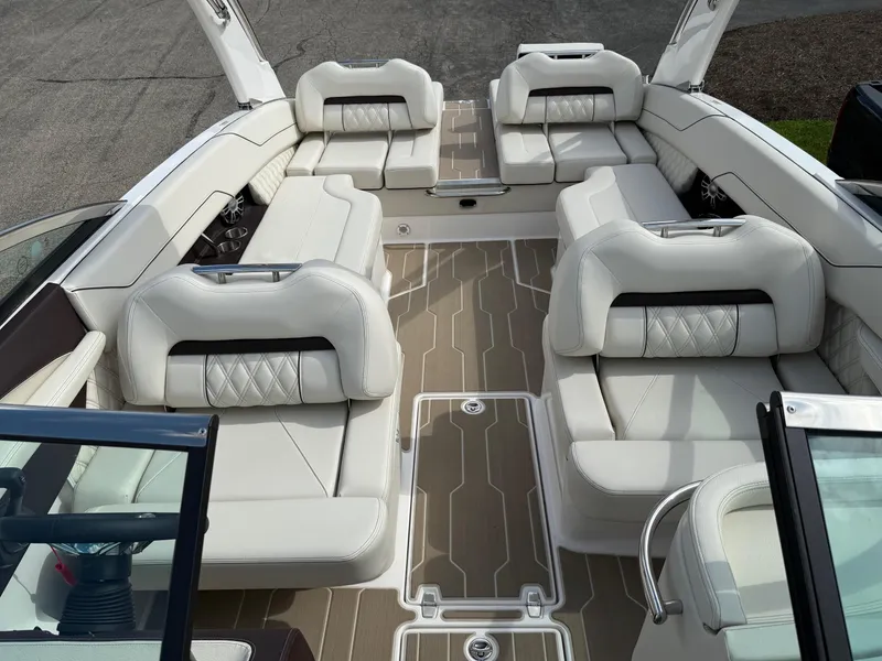 Slide: The Image of 2025 Regal LS6 boat interior with luxurious white seating and modern design. - 4