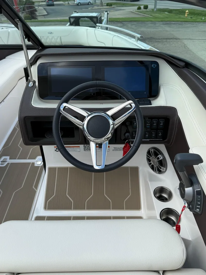 Slide: The Image of 2025 Regal LS6 boat dashboard with modern steering wheel and digital displays. - 9