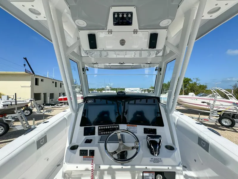 Slide: The Image of 2025 Sea Fox 328 Commander boat cockpit with modern controls and dual screens. - 16