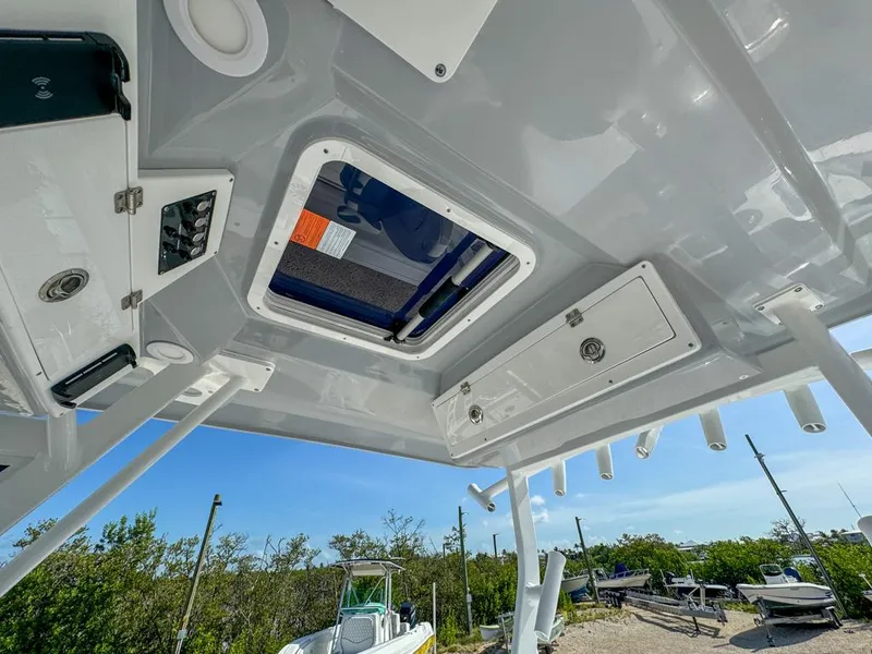 Slide: The Image of 2025 Sea Fox 328 Commander boat interior with storage compartments and hatch. - 18