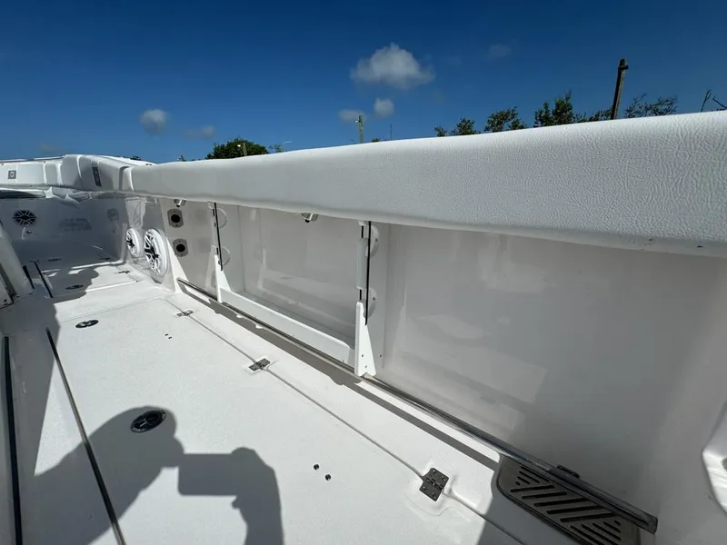 Slide: The Image of 2025 Sea Fox 328 Commander boat deck, white interior, sunny day. - 26