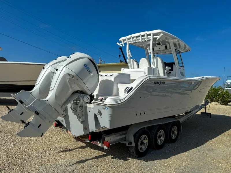 Slide: The Image of 2025 Sea Fox 328 Commander with twin 300 V6 engines, rear view. - 4