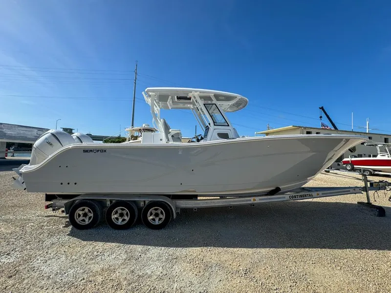 Slide: The Image of 2025 Sea Fox 328 Commander boat with Yamaha engines on a trailer. - 5