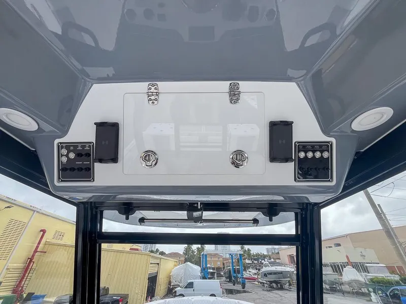 Slide: The Image of 2025 Sea Fox 368 Commander boat dashboard with modern controls and storage compartments. - 27