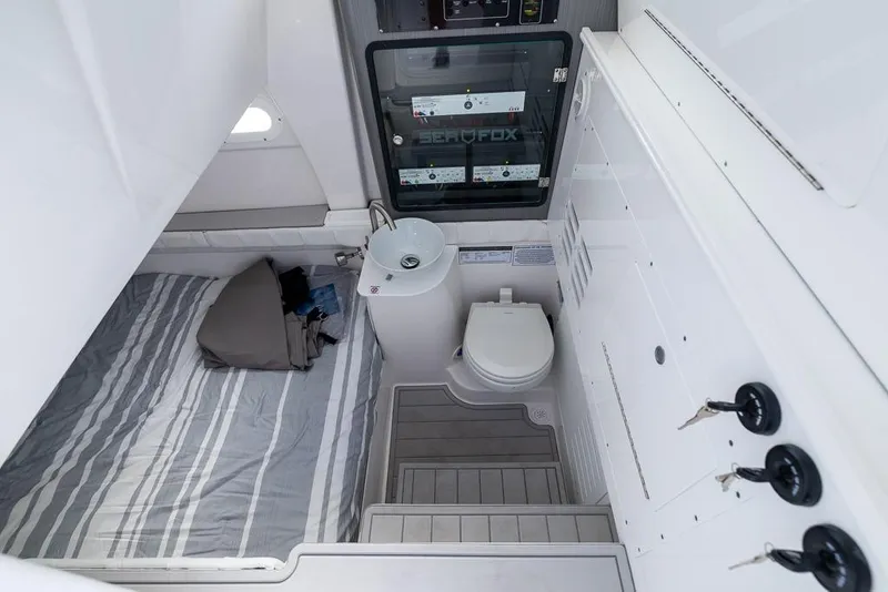 Slide: The Image of Interior of 2025 Sea Fox 368 Commander featuring bed, sink, and toilet. - 35
