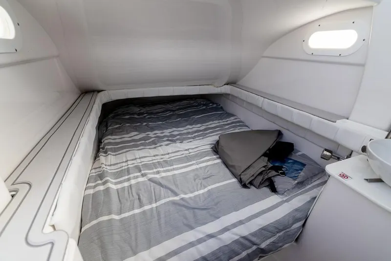 Slide: The Image of Interior cabin of 2025 Sea Fox 368 Commander with striped bedding and compact design. - 36