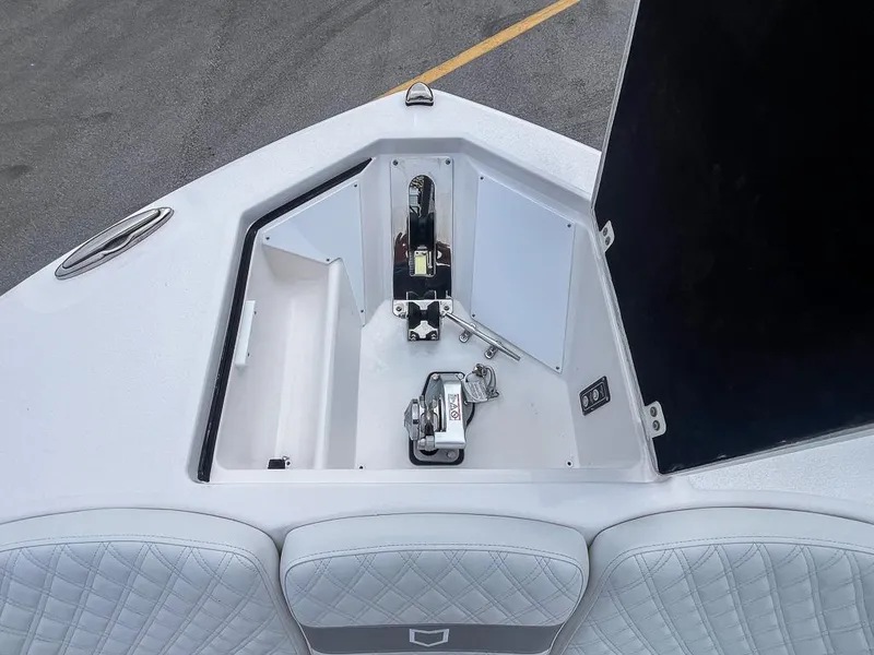 Slide: The Image of 2025 Sea Fox 368 Commander anchor compartment with winch and storage. - 39