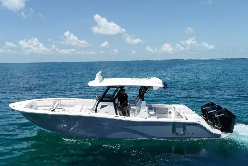 Slide: The Image of 2025 Sea Fox 368 Commander boat cruising on clear blue ocean waters. - 6