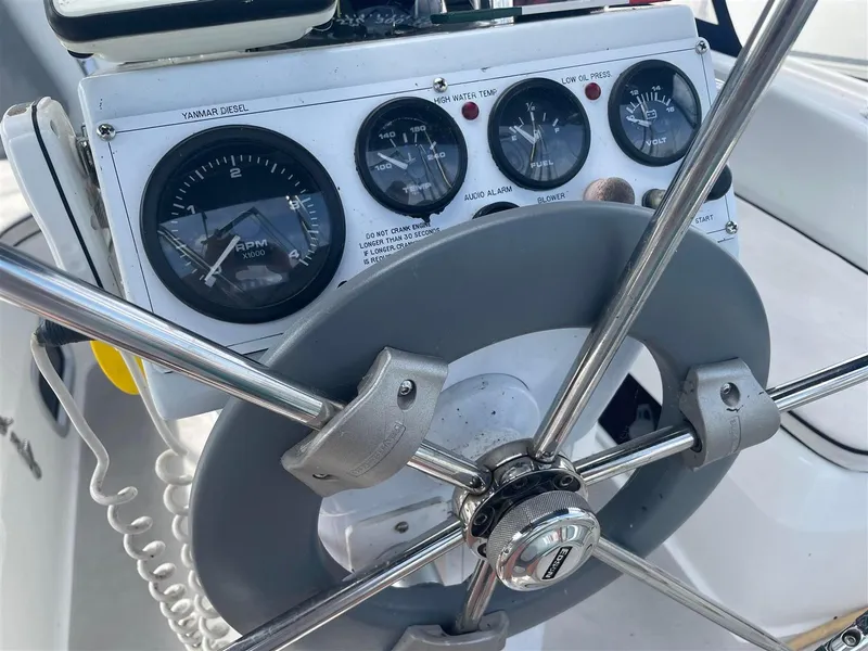Slide: The Image of Close-up of 2008 Catalina 320 MkII sailboat helm with gauges and steering wheel. - 17
