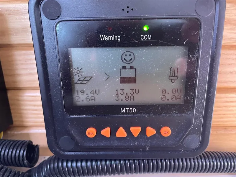 Slide: The Image of Catalina 320 MkII 2008 solar charge controller display showing voltage and current readings. - 45
