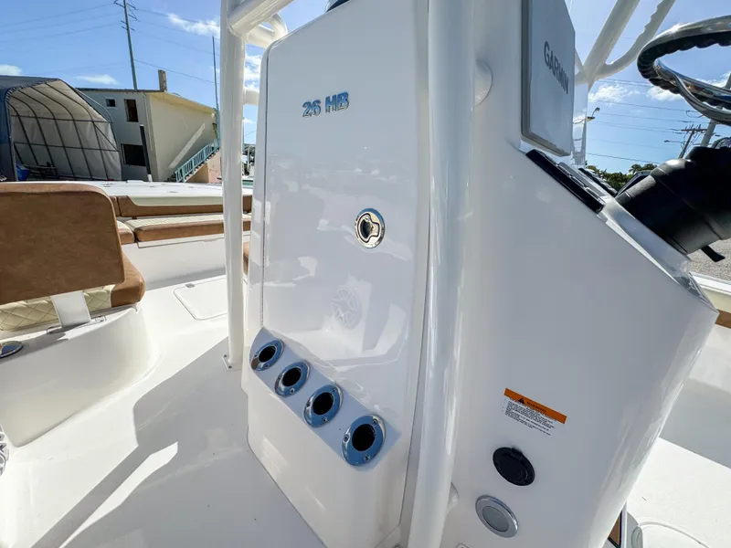 Slide: The Image of 2024 Caymas 26 HB boat interior with control panel and seating. - 25