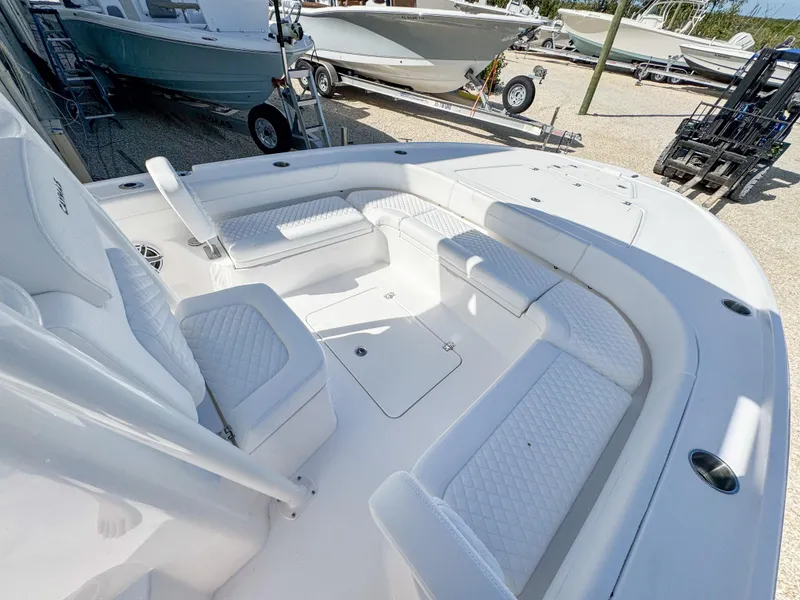 Slide: The Image of 2024 Caymas 26 HB boat with spacious seating and sleek design. - 16