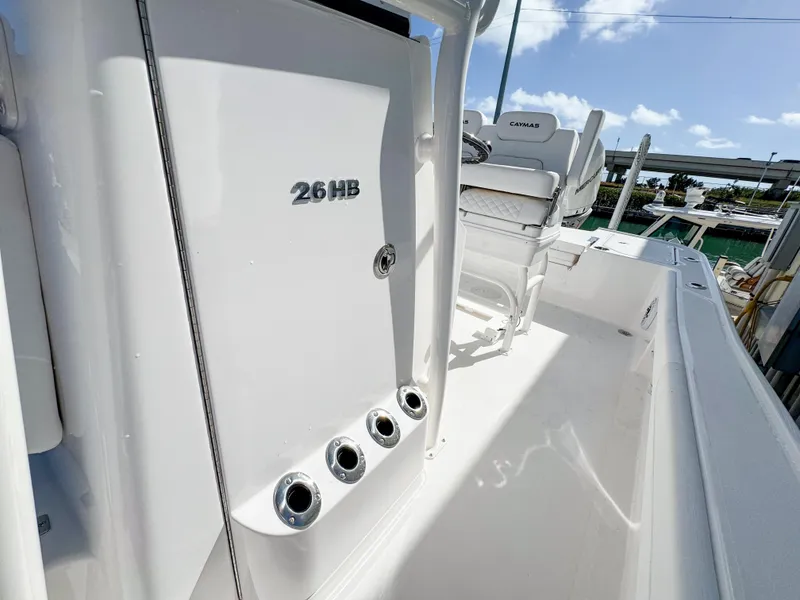 Slide: The Image of 2024 Caymas 26 HB boat interior with seating and storage compartments. - 21
