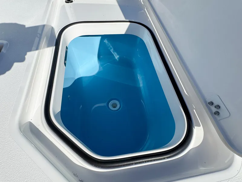 Slide: The Image of 2024 Caymas 28 HB livewell with blue interior, open lid. - 13