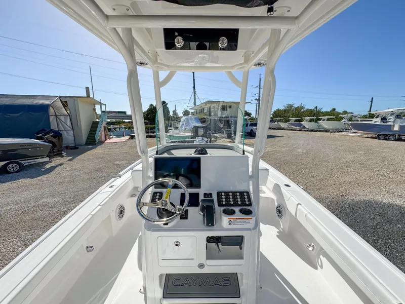 Slide: The Image of 2024 Caymas 28 HB boat cockpit with steering wheel and control panel. - 15