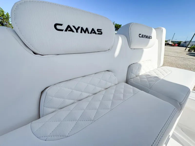 Slide: The Image of 2024 Caymas 28 HB boat with luxurious white quilted seating. - 18