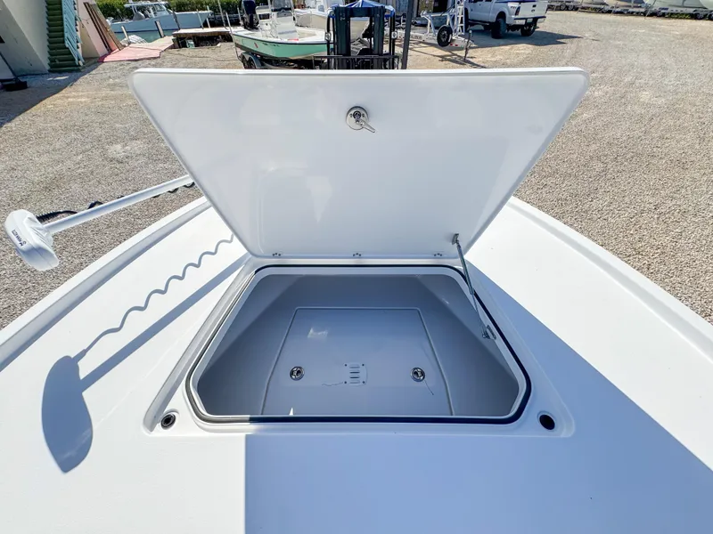 Slide: The Image of 2024 Caymas 28 HB boat with open storage compartment on deck. - 25