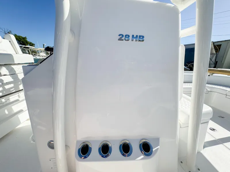 Slide: The Image of 2024 Caymas 28 HB boat interior with rod holders and sleek design. - 29