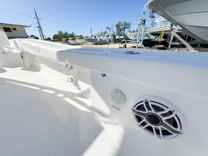 Slide: The Image of 2024 Caymas 28 HB boat interior with speaker and sleek white design. - 31