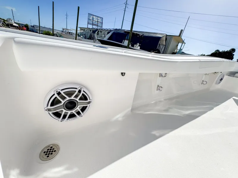 Slide: The Image of 2024 Caymas 28 HB boat interior with speaker and drain detail. - 32