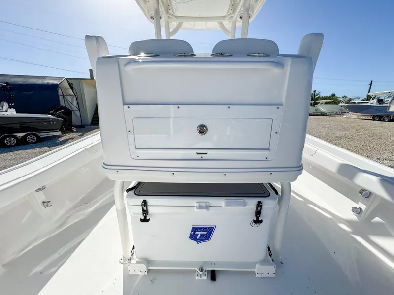 Slide: The Image of 2024 Caymas 28 HB boat interior with storage and cooler. - 9