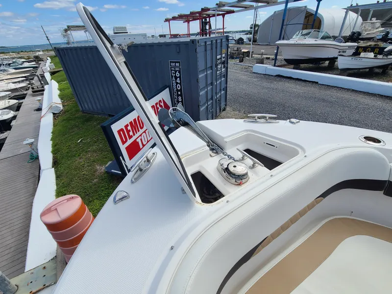 Slide: The Image of 2018 Edgewater 262 CX boat anchor compartment at marina. - 5