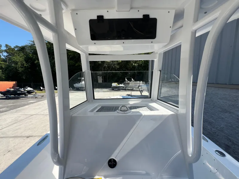 Slide: The Image of 2025 NauticStar 252L boat interior with modern helm design. - 16