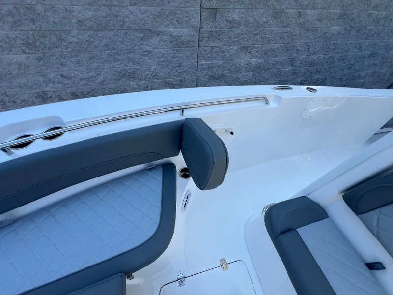 Slide: The Image of 2025 NauticStar 252L boat interior with gray seating and sleek design. - 30